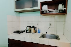Apartment, 2 Bedrooms | Private kitchen | Full-size fridge, stovetop