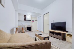 Apartamento, 2 quartos | Área de estar