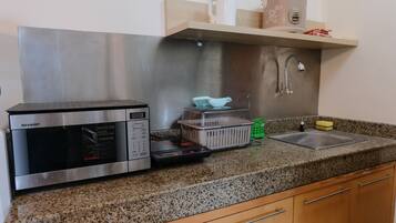 Apartment, 2 Bedrooms | Private kitchen | Full-size fridge, stovetop