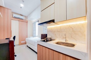 Appartement | Cuisine privée | Réfrigérateur grande capacité avec congélateur, surface de cuisson