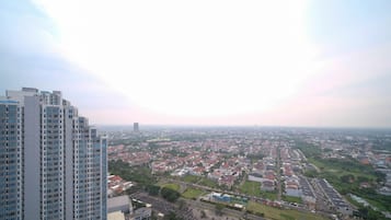 A high-rise building with multiple floors and a large windowed facade.