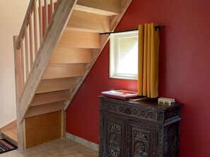 A staircase with wooden steps leading to a landing.