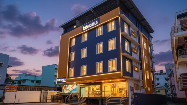 A multi-story building with a sign reading "fabHOTELS" at the top. - FabHotel VJR Electronic City (Bengaluru)