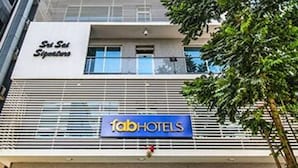 A modern building with a 'fabHOTELS' sign and a 'Sri Sab Signature' sign above the entrance. - Fabhotel Pearl City (Hyderabad)