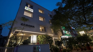 A modern hotel building with a sign for 'Treebo' and 'Cabana Hotel'. - Treebo Cabana (New Delhi)