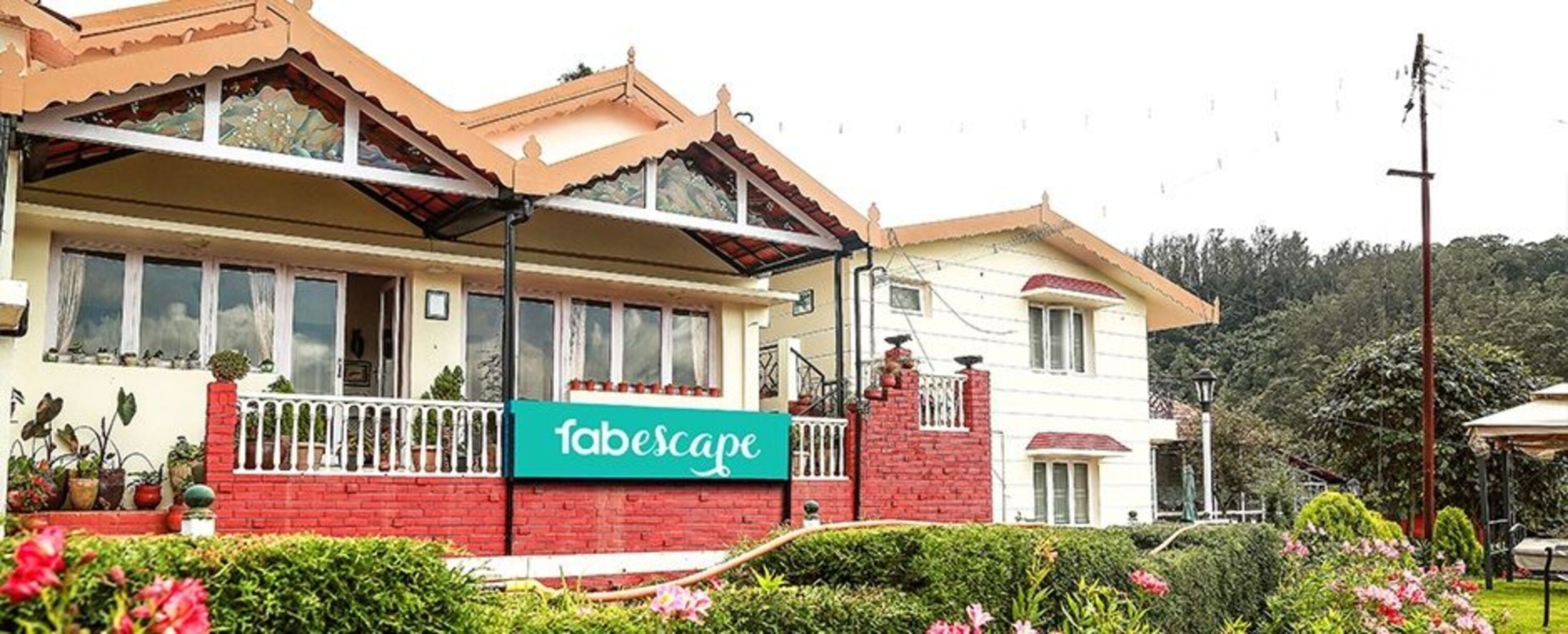 A two-story building with a sign reading "fabescape".
