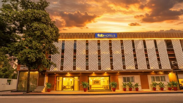A hotel facade with a patterned exterior and a sign reading "fabHOTELS". - Fabhotel Landmark Residency (Navi Mumbai)
