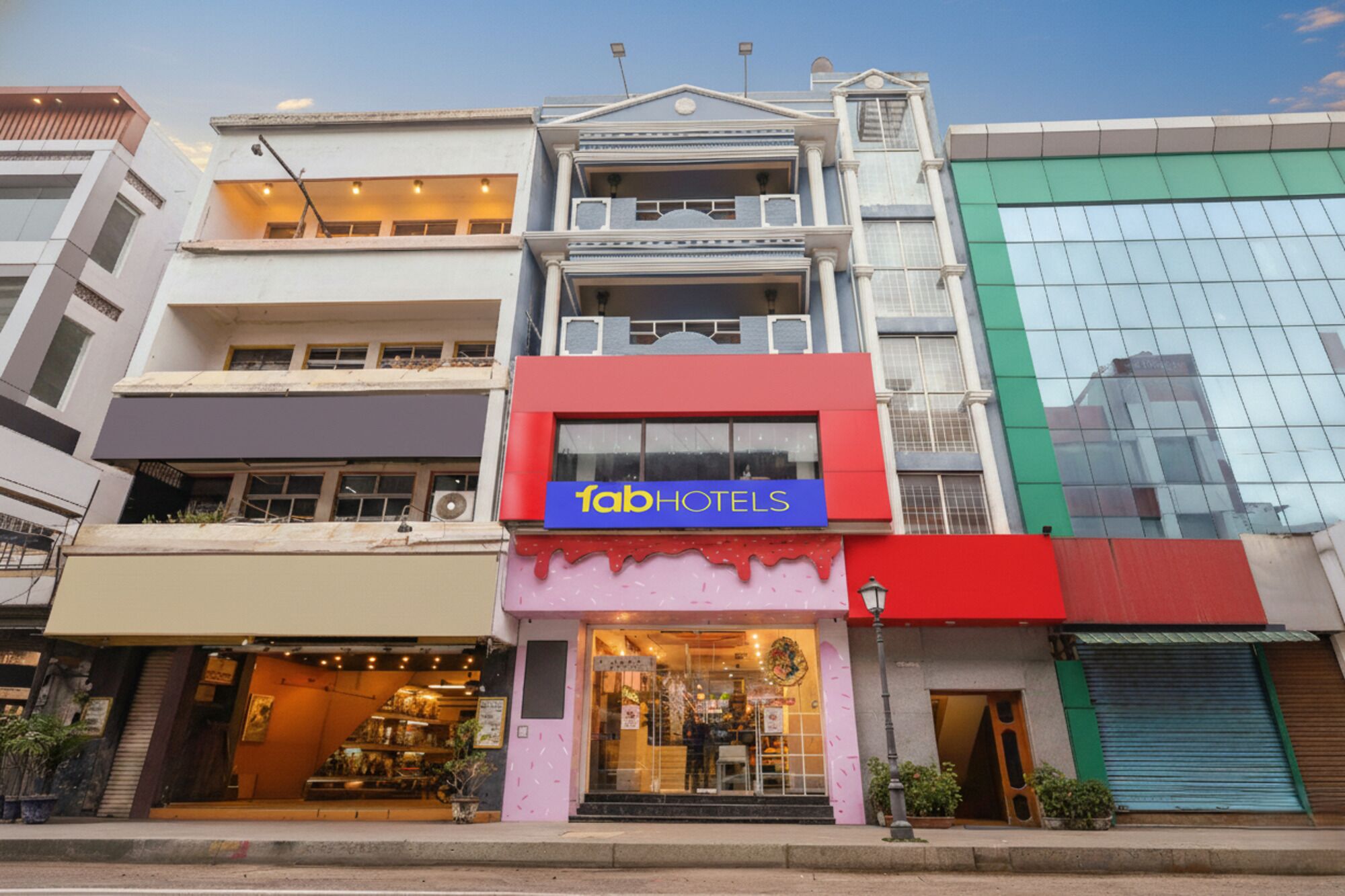 A multi-story building with a prominent 'fabHOTELS' sign.