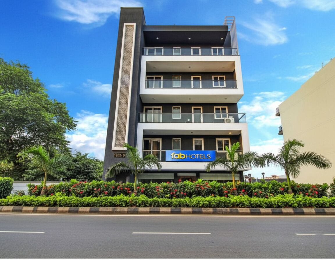 A multi-story building with a sign for 'Fabo Hotels'.