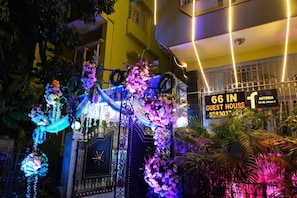 A hotel entrance with a sign indicating '66 IN GUEST HOUSE' and 'ASTORIA F11-66, Seater 2'. - FabHotel Astoria House (Bidhannagar)