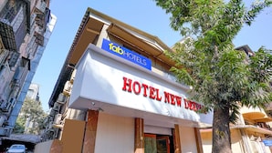 A hotel named "HOTEL NEW DEENP" with a sign for "Tab Hotels" above it. - Fabexpress New Deepak (Mumbai)