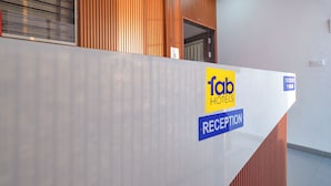 A reception area with a 'fab hotels' sign and a 'reception' label.