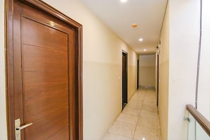 Corridors lead to door 216, offering access to a space.