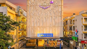 The Berry's Hotel with a distinctive facade featuring a large, ornate sign and a modern design. - Fabhotel Astra Berry'S (Bengaluru)