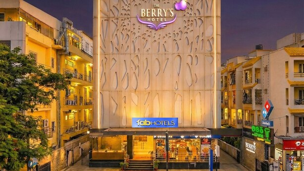 The Berry's Hotel with a modern facade and a prominent sign. - Fabhotel Astra Berry'S (Bengaluru)