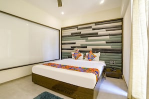 ห้องดีลั�กซ์ | ผ้าปูที่นอนฝ้ายอียิปต์, เครื่องนอนระดับพรีเมียม, ตู้นิรภัยในห้องพัก