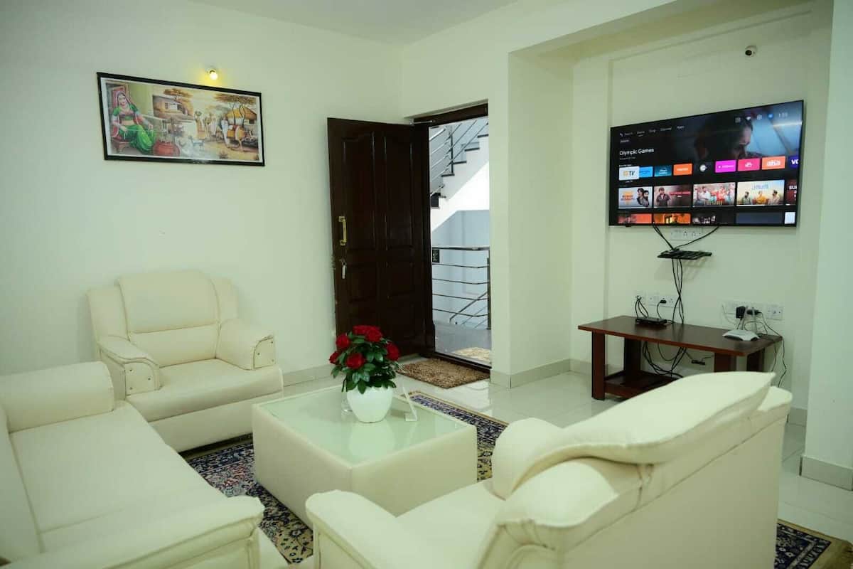 Deluxe Apartment, Multiple Beds | Living area | 28-inch LCD TV with cable channels, TV