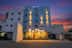 A multi-story hotel with a sign reading "Hotel Ark of Avalon" and "fabHOTELS" above. - Fabhotel Airport Avalon (New Delhi)