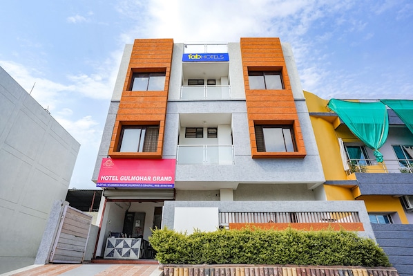 A multi-story hotel with a modern design, featuring a prominent 'fab hotels' sign.