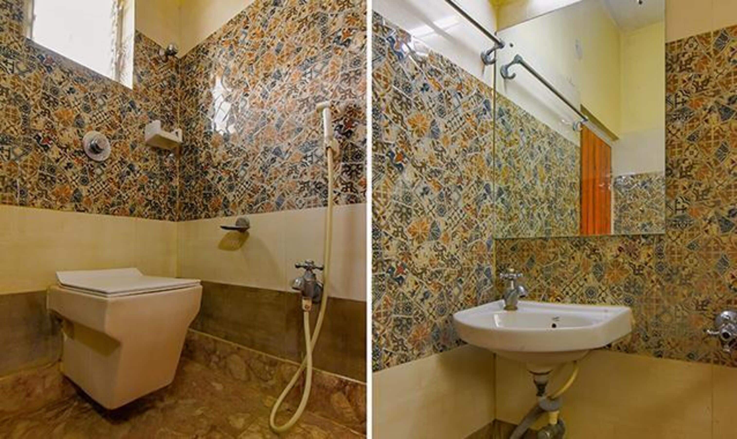 deluxe room | bathroom | shower, rainfall showerhead, free toiletries, towels