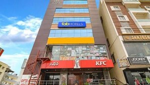 A multi-story building with a KFC restaurant on the ground floor, a JPS Plaza sign above, and a Tabb Hotels sign on the second floor. - Via Athidhi Stay Inn (Hyderabad)