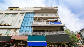 A multi-story building with a sign for 'Clark Heights' on the top floor.