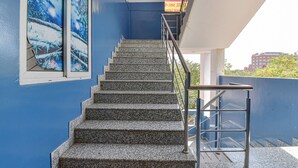 A staircase with metal railings leading to a balcony. - FabHotel Green Vista Malviya Nagar (Jaipur)