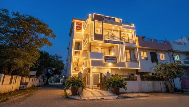 A multi-story hotel with balconies, a well-lit entrance, and signage for 'Green Vista' and 'fabHOTELS'. - FabHotel Green Vista Malviya Nagar (Jaipur)