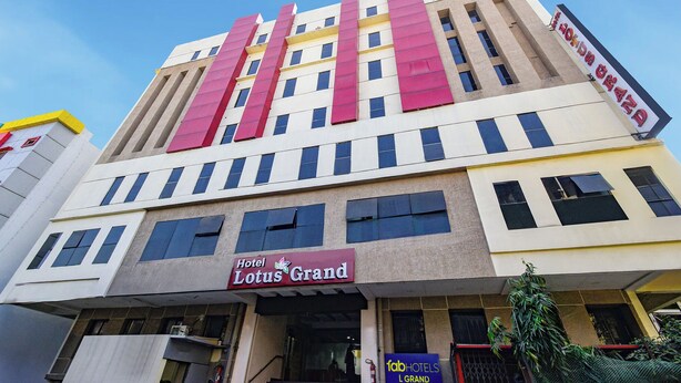 A hotel building with a prominent 'Hotel Lotus Grand' sign. - Fabhotel L Grand (Hyderabad)