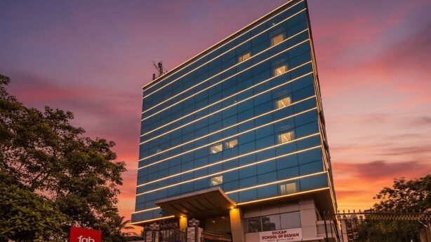 A modern high-rise building with a flat facade and horizontal lines of windows. - FabHotel Ascot International (Mumbai)