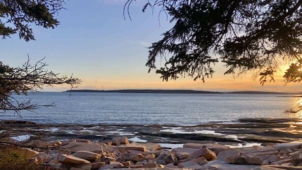 A rocky shoreline with large boulders and sparse vegetation. - Wonderland Home | 2BR retreat, mins to Acadia NP (Tremont)