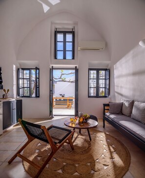 Cave One-Bedroom Suite | Living area - Firalia, Casa In Rock Suites (Santorini)
