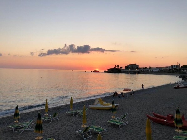Beach nearby, white sand, beach volleyball