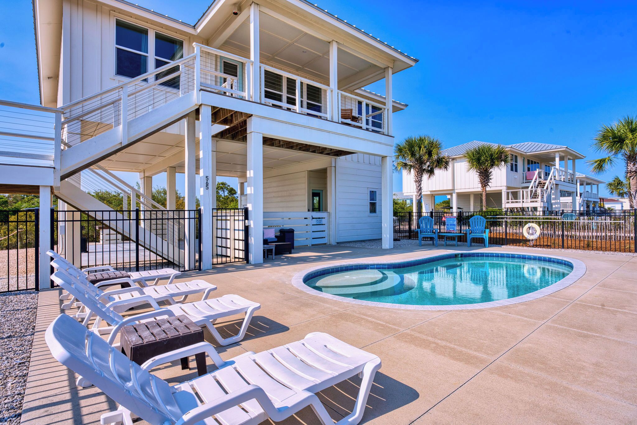 A heated pool, sun loungers