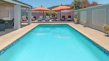 Outdoor pool, pool umbrellas, sun loungers