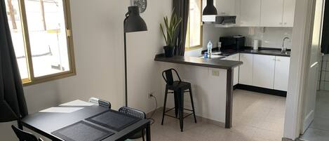 Coffee/tea maker, fridge, microwave, oven