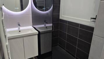 Shower, hair dryer, towels, toilet paper