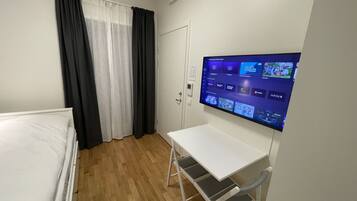 Studio | Down duvets, desk, laptop workspace, blackout curtains