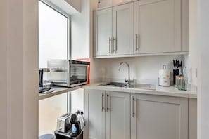 Fridge, microwave, electric kettle, toaster