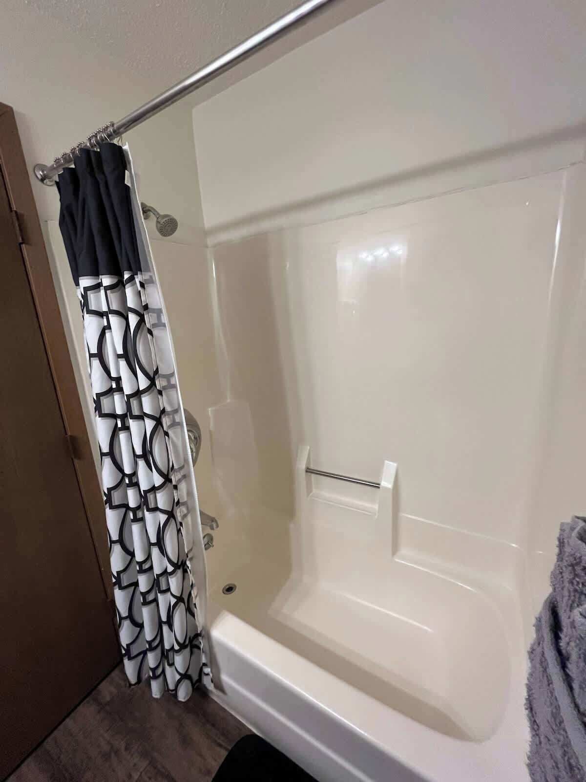 Bathtub, hair dryer, towels
