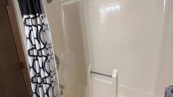 Bathtub, hair dryer, towels
