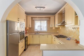 Fridge, dishwasher, coffee/tea maker, cookware/dishes/utensils