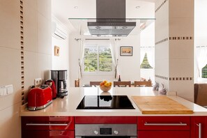 Microwave, oven, dishwasher, dining tables
