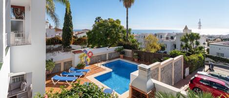 A heated pool, pool loungers