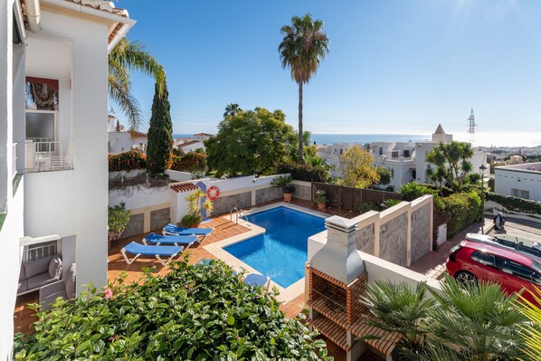 A heated pool, pool loungers