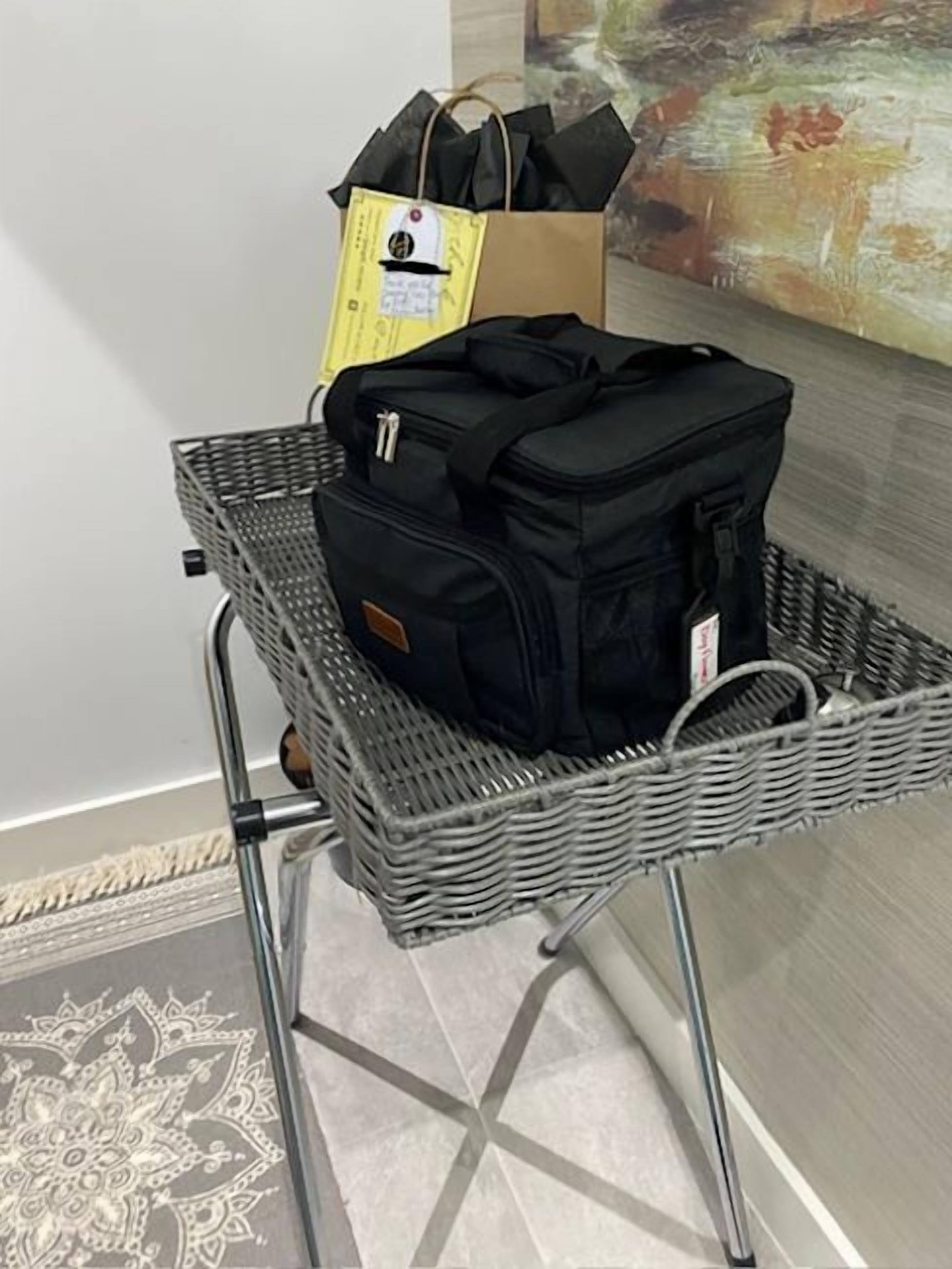 A metal cart with a wicker basket containing a black bag and a yellow shopping bag.