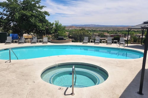 Seasonal outdoor pool, open 7:00 AM to 10:30 PM, pool umbrellas