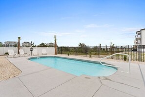 A heated pool - All The Ocean Views at this luxury 5 bed 5 bath beach home (Ocean Isle Beach)