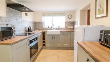 Fridge, electric kettle, toaster, cookware/dishes/utensils