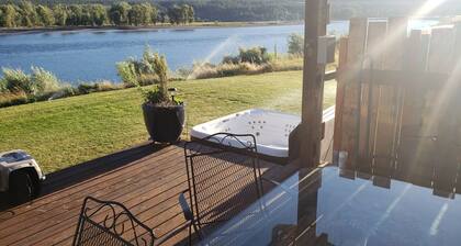 Relax and make magical memories at Our Riverfront Retreat!